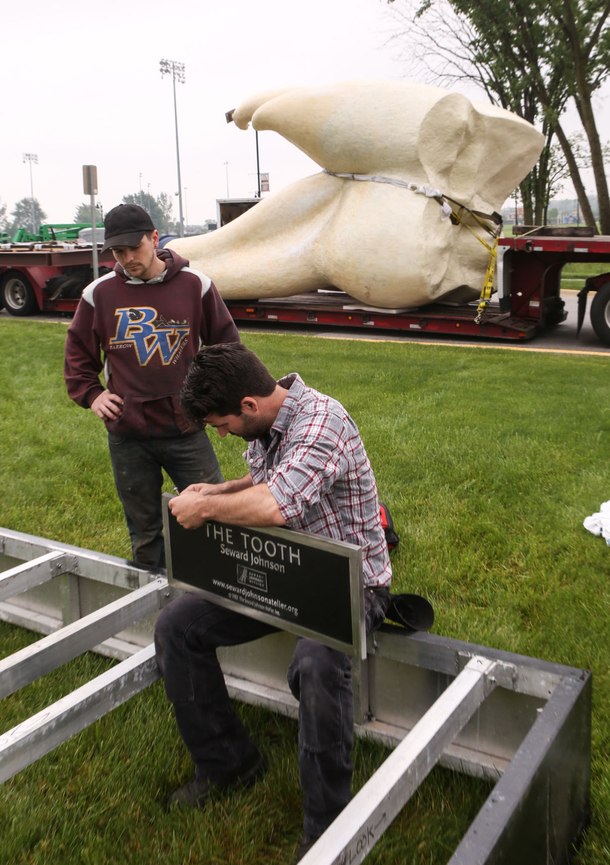 Artist Seward Johnson's "The Tooth" is implanted at the Crown Point Sportsplex